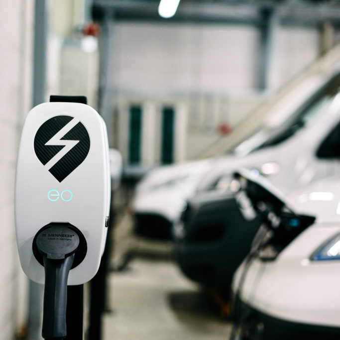 Electric Vans plugged into an EV Charger